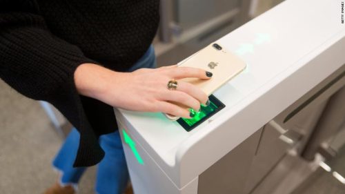 An Amazon.com Inc. employee scans in to shop at the Amazon Go store in Seattle, Washington, U.S., on Wednesday, Jan. 17, 2018. After more than a year of testing with an employee-only focus group, Amazon Go opens to the public Monday in downtown Seattle, putting to the test the online retailer's technology that lets shoppers grab what they want and leave without paying a cashier. Photographer: Mike Kane/Bloomberg